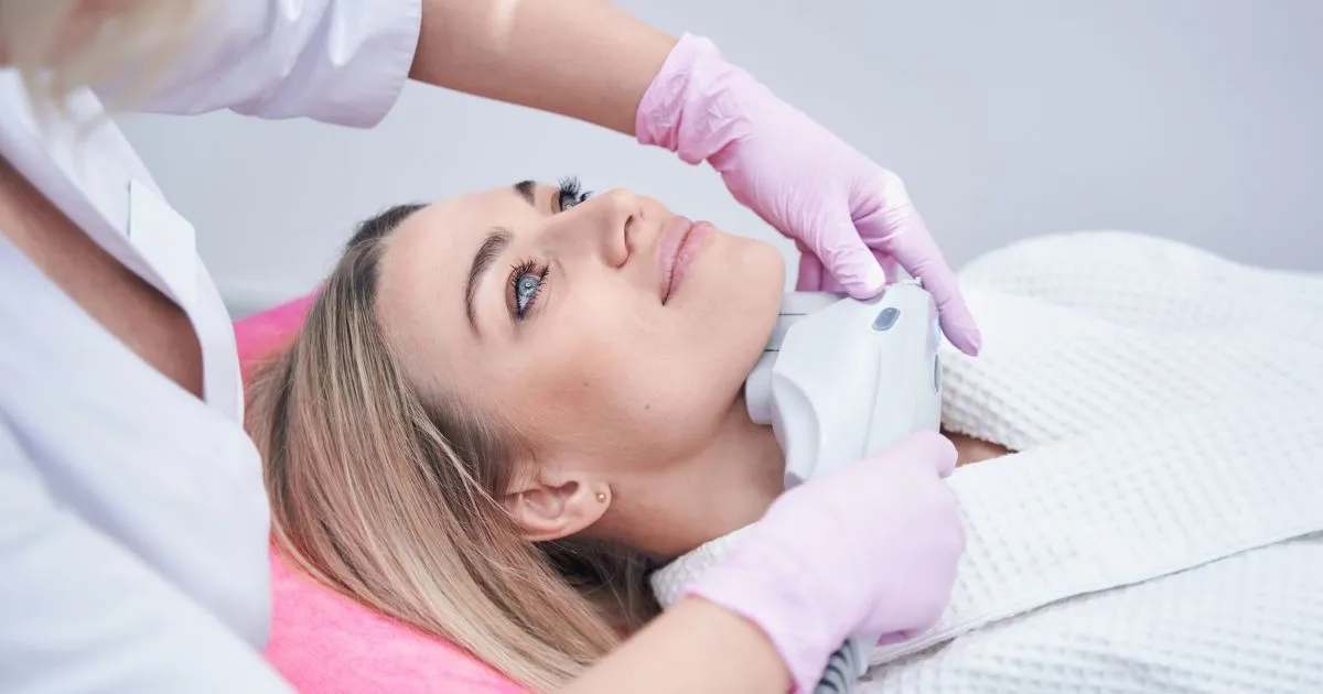 A woman receiving a Sofwave treatment on her jawline in Bothell, WA